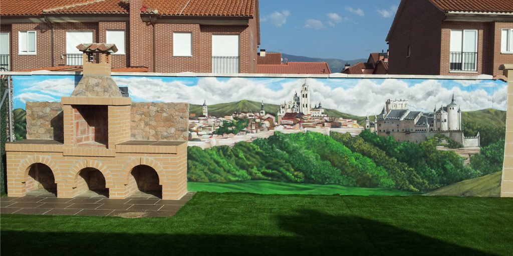 Mural-de-segovia-en-jardin Graffiti mural de Segovia en jardín con barbacoa