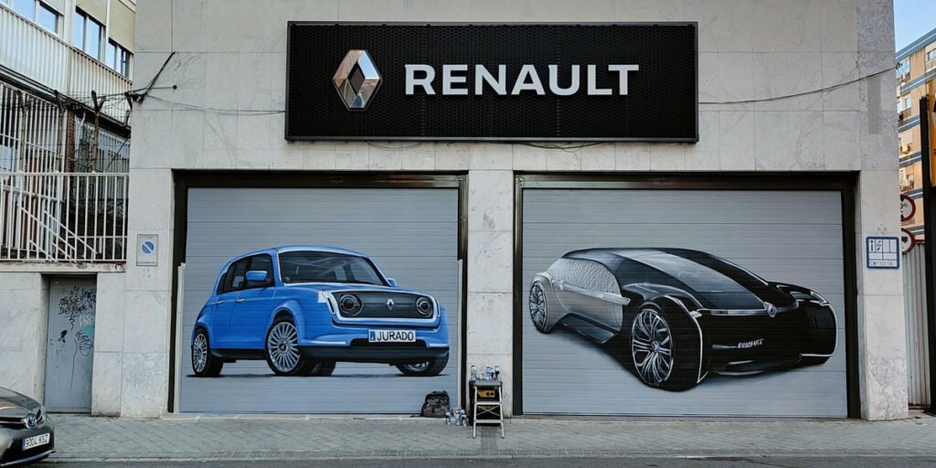 Graffiti en las puertas de concesionario de Renault en Madrid